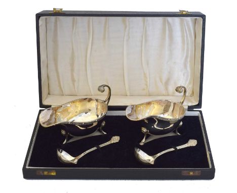 A George IV silver cased sauce boat and ladle set, A George IV silver cased sauce boat and ladle set, Celtic pattern, within 