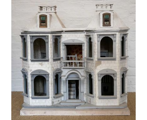 A Late Victorian or Edwardian Doll's House A Late Victorian or Edwardian Doll's House, with four rooms and central staircase,