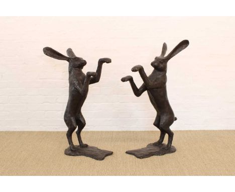 A Pair of Cast Bronze Boxing Hares A Pair of Cast Bronze Boxing Hares, late 20th century, modelled after Mene with impressed 