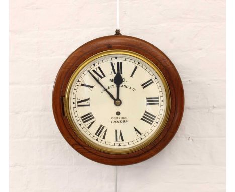 A Reproduction Circular Wall Clock  A Reproduction Circular Wall Clock, the 10 1/2" dial set with Roman numerals and bearing 