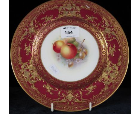 Royal Worcester bone china cabinet plate with over gilded red border and central field painted with fruit, signed H. Aynton. 