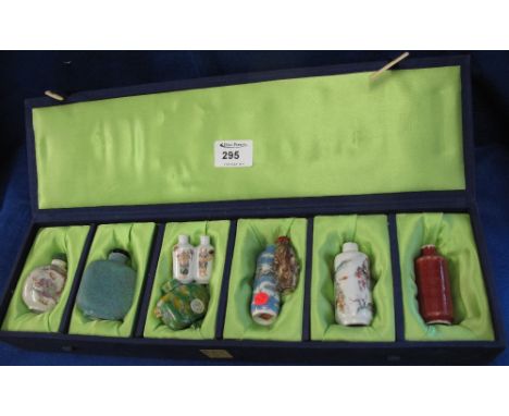 Collection of Chinese ceramic snuff bottles, various, including Sang de boeuf, Canton and others, in lined box.
*** CONDITION