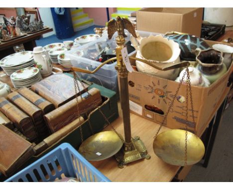 Gilt brass shop balance scales on a fluted column with a foliate decorated base and eagle finial.