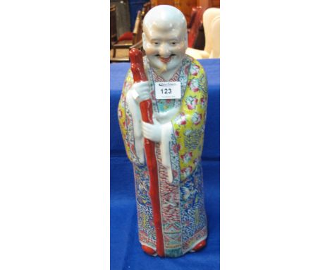 Large Chinese standing immortal figure holding a stick.  Square seal mark to base.  Height 46cm approx.
*** CONDITION REPORT: