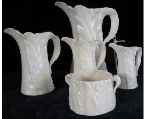 Group of four graduated Royal Worcester Blanc de Chine glazed leaf jugs with printed marks and date cipher for 1896 and other