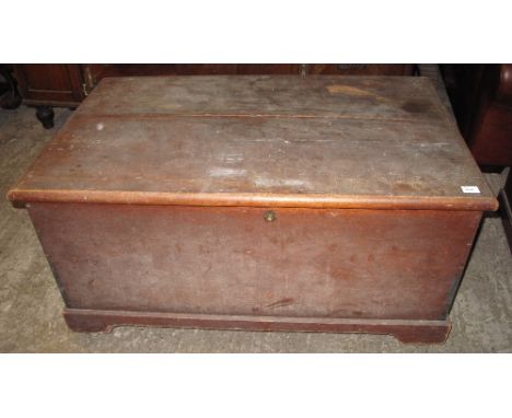 Large 19th Century stained pine trunk with cast metal carrying handles.