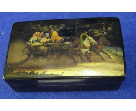 Russian ebonised and lacquered stamp box with printed carriage scene and Imperial eagles with script to the interior together