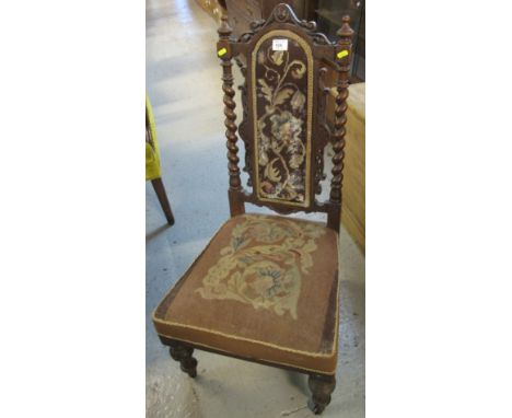 Victorian tapestry seated nursing chair with scrolled and barley twist supports and decoration.