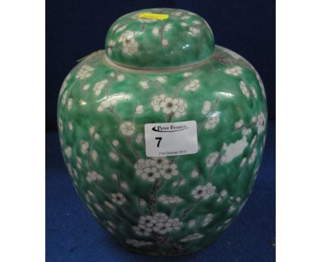 Kangxi style green glazed lidded ginger jar with overall prunus blossom decoration.  8" high approx.
 CONDITION REPORT: Very 