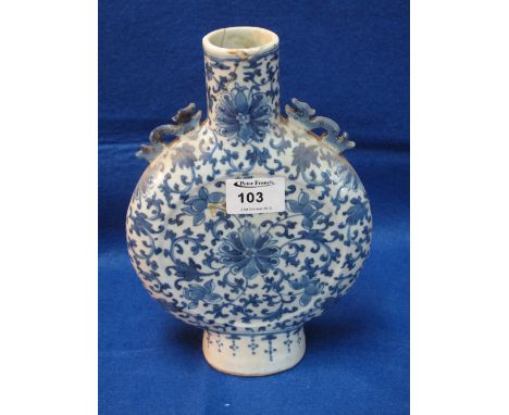 A blue and white Chinese porcelain moon flask with overall lotus scroll decoration. 10" high.
 CONDITION REPORT: Significant 