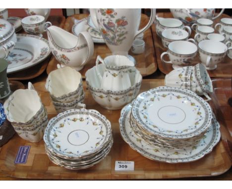 Tray of Victoria china teaware items on a white ground with floral and swag decoration, comprising cups, saucers, plates, mil