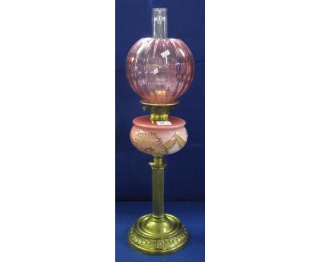 Early 20th century brass double burner oil lamp with painted glass reservoir on a brass base, with fluted shade and clear chi