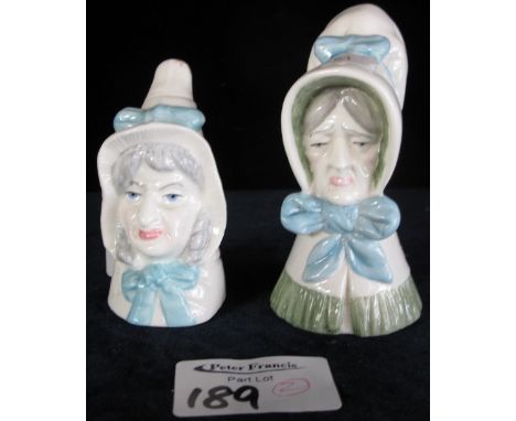 Two similar Royal Worcester bone china candle snuffers in the form of bonneted ladies.  Printed marks. (2)