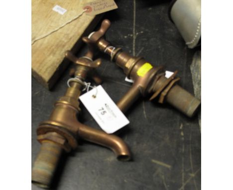 Pair of vintage brass pillar taps with ceramic tops.