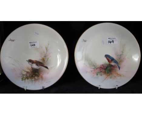 Pair of Royal Worcester porcelain plates painted with birds among foliage and signed E. Barker.  Printed marks with date ciph