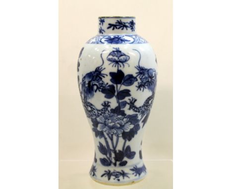 Chinese small blue and white baluster vase, decorated with two scrolling dragons amongst foliage and flowers, double undergla