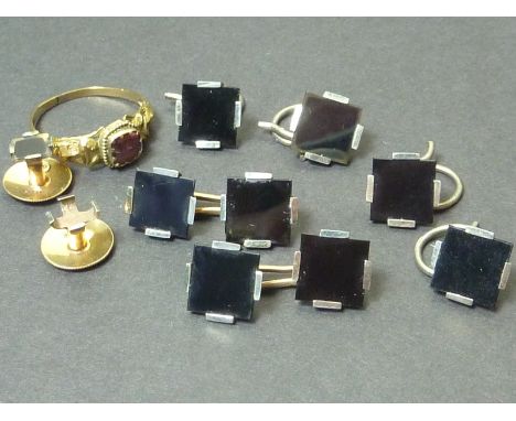 Set of onyx and gold studs, buttons and links, and a garnet ring.
