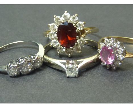 Two gem rings in 9ct gold, a diamond three stone ring and another. (4).