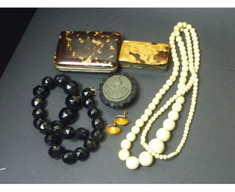 Lave cameo of a woman in jet frame, a similar bead necklet, a tortoiseshell purse and snuff box and various other items.