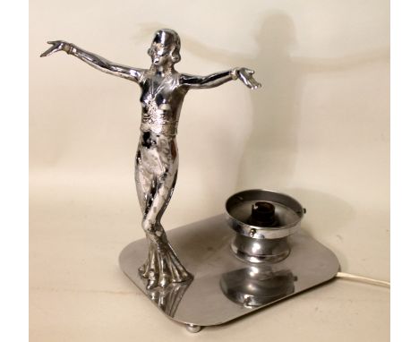 Art Deco chrome plated table lamp, in the form of a woman standing with outstretched arms on rounded rectangular plinth base 