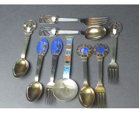Four pairs of Swedish enamelled silver Christmas spoons and forks, 1936 / 8/9 and a similar spoon with enamelled badges   Con