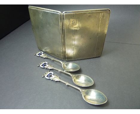 Silver cigarette case and three decorative spoons.