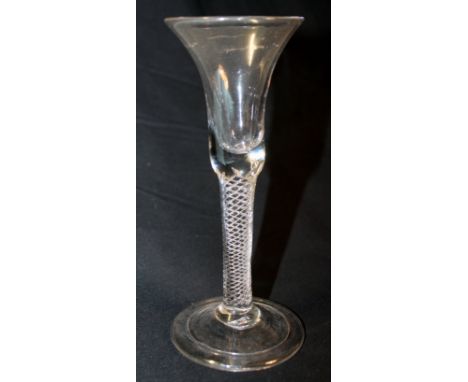 Antique drinking glass,  the slender bell shaped bowl on drawn air twist stem and domed circular folded foot, 17cm high.   Co