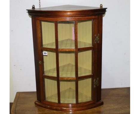 Small mahogany bow front hanging corner cabinet with multi pane glazed door. 51cm wide.