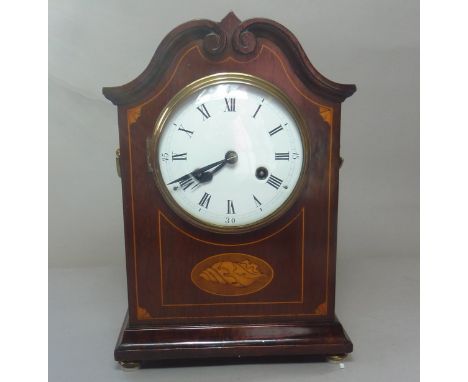 Edwardian inlaid mahogany mantel clock with twin brass ring handles, inlaid shell patera on turned bun feet, 33cm
