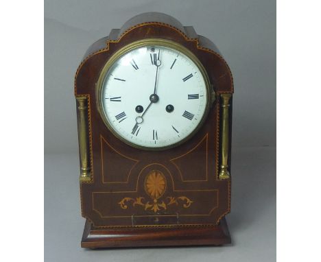 Edwardian inlaid mahogany mantel clock, the white enamel dial flanked by two brass columns, 30cm