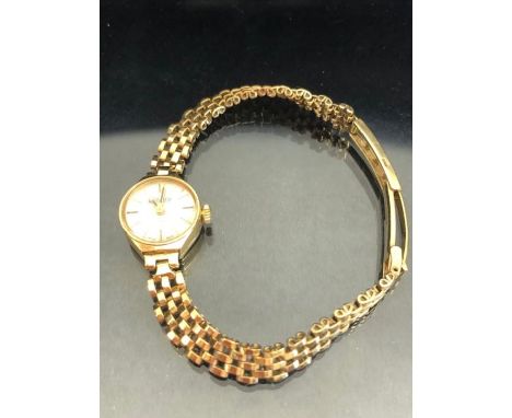 Roamer manual wind 9ct gold wristwatch having a silvered dial and baton markers, 9ct gold bracelet and clasp with Incabloc17 