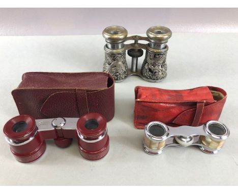 Three sets of Opera Glasses two cased and one with silver Bird detailing 