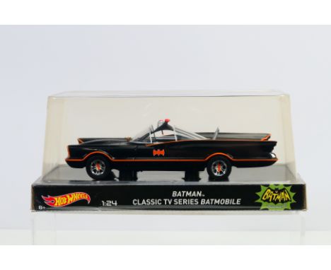 Batman - Hot Wheels - A factory sealed classic TV Batmobile inn 1:24 scale # BLY66. The model appears Mint in Very Good unope