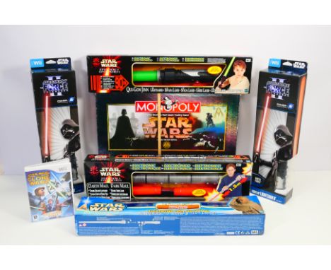 Hasbro - Wii - Parker Brothers - A trio of boxed Hasbro 'Star Wars' themed lightsabers, with two Wii 'Star Wars the Force Unl