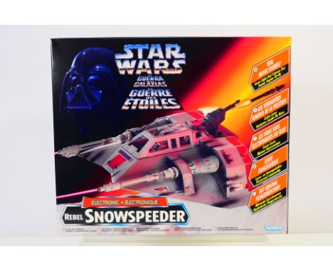 Star Wars - Kenner - New Old Stock - A factory sealed 1996 dated Tri Logo Rebel Snowspeeder Electronic # 69585.134. The box a