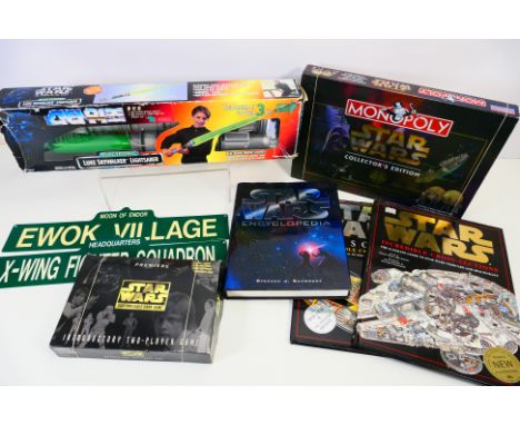 Star Wars - Monopoly - A group of Star Wars items including Luke Skywalkers Electronic Lightsaber, Card Game, books and 2 x w