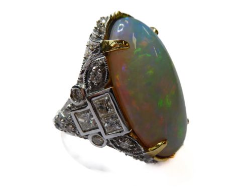 A large opal and diamond-set 18-carat gold ring