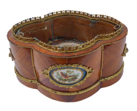 A 19th century French kingwood gilt-metal-mounted jardinière of quatrefoil form: the pierced gallery above a central front Sè