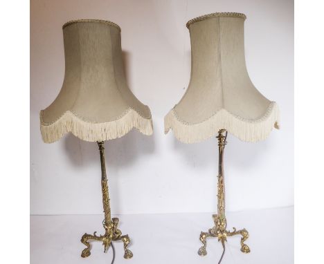 A fine, large and heavy, pair of 19th century gilt-metal candlesticks (now adapted and as table lamps); the candleholders wit