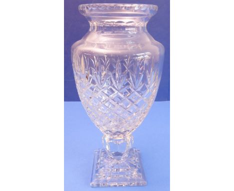 A large and heavy hand-cut clear-glass vase of baluster form - diamond-cut body above a stepped square plinth with lemon-sque