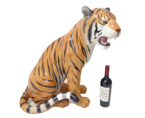 An large Italian hand-painted ceramic model of an open-mouthed tiger cub (tail broken and extensively repaired) (66cm high to