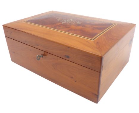 A modern wooden casket probably yew and burr yew); the hinged top with a figured panel inlaid with silver-coloured wire and w