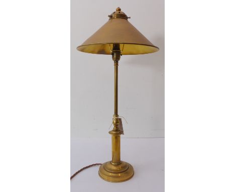 A 19th century style (later) brass table lamp; fan-shaped conical brass shade above a turned stem and on circular foot (59cm 