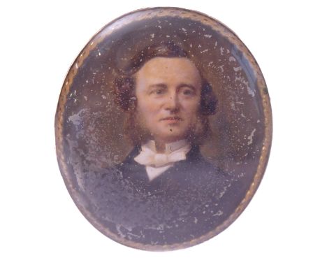 A 19th century gilt framed oval portrait shoulder length miniature; Victorian gentleman with white cravat, bow tie and black 