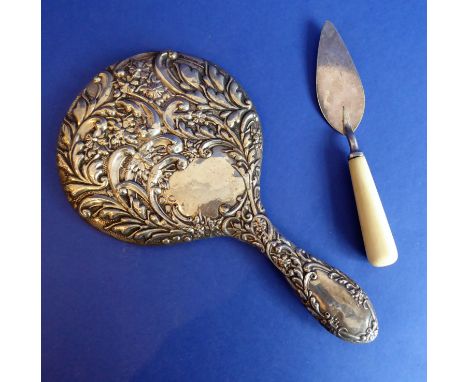 An early 20th century Edwardian hallmarked silver lady's dressing table hand-held mirror (assayed Chester 1907), together wit