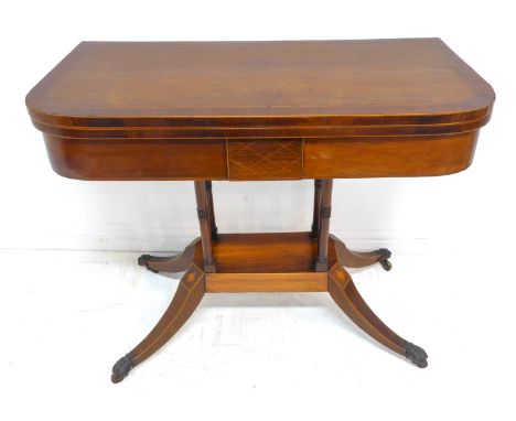 An early 19th century Regency period rosewood card table -&nbsp;crossbanded and boxwood-strung, the foldover top lifting to r