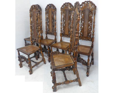 A set of six, probably 19th century, carved walnut high-back chairs in late 17th century style: rattan caned backrests and se