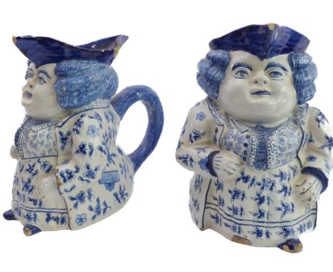 A pair of Delftware Toby jugs&nbsp; - probably late 19th or early 20th century, modelled as corpulent figures with bicorn hat
