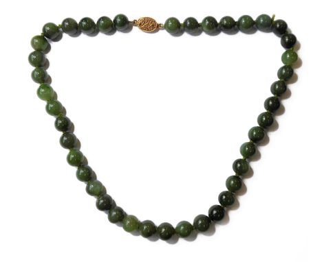 A green hardstone bead necklace (possibly green jade) - ornate filigree-style silver-gilt clasp (45cm) (boxed)