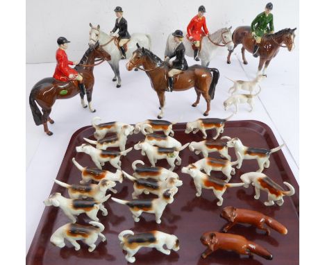 A 29-piece Beswick hunting group: 5 horse-and-rider figures, 22 foxhounds and 2 foxes (various printed marks) Condition Repor